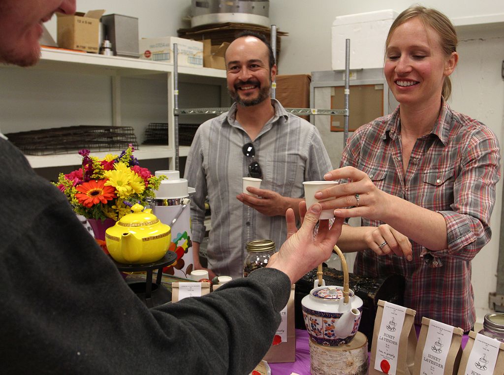  Dana Blair and her partner, Steve Chavez serving a sample of tea.o.graphy's Honey Lavender blend at TCEDC's Valentine Weekend event. 